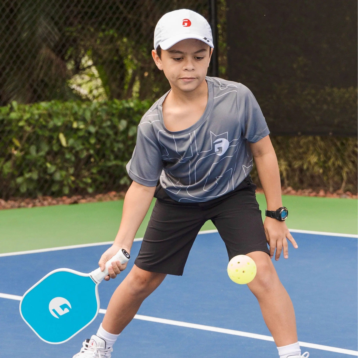 Set of pickleball paddles with wide faces, smooth graphic designs, and cushioned grip handles for responsive control and performance.