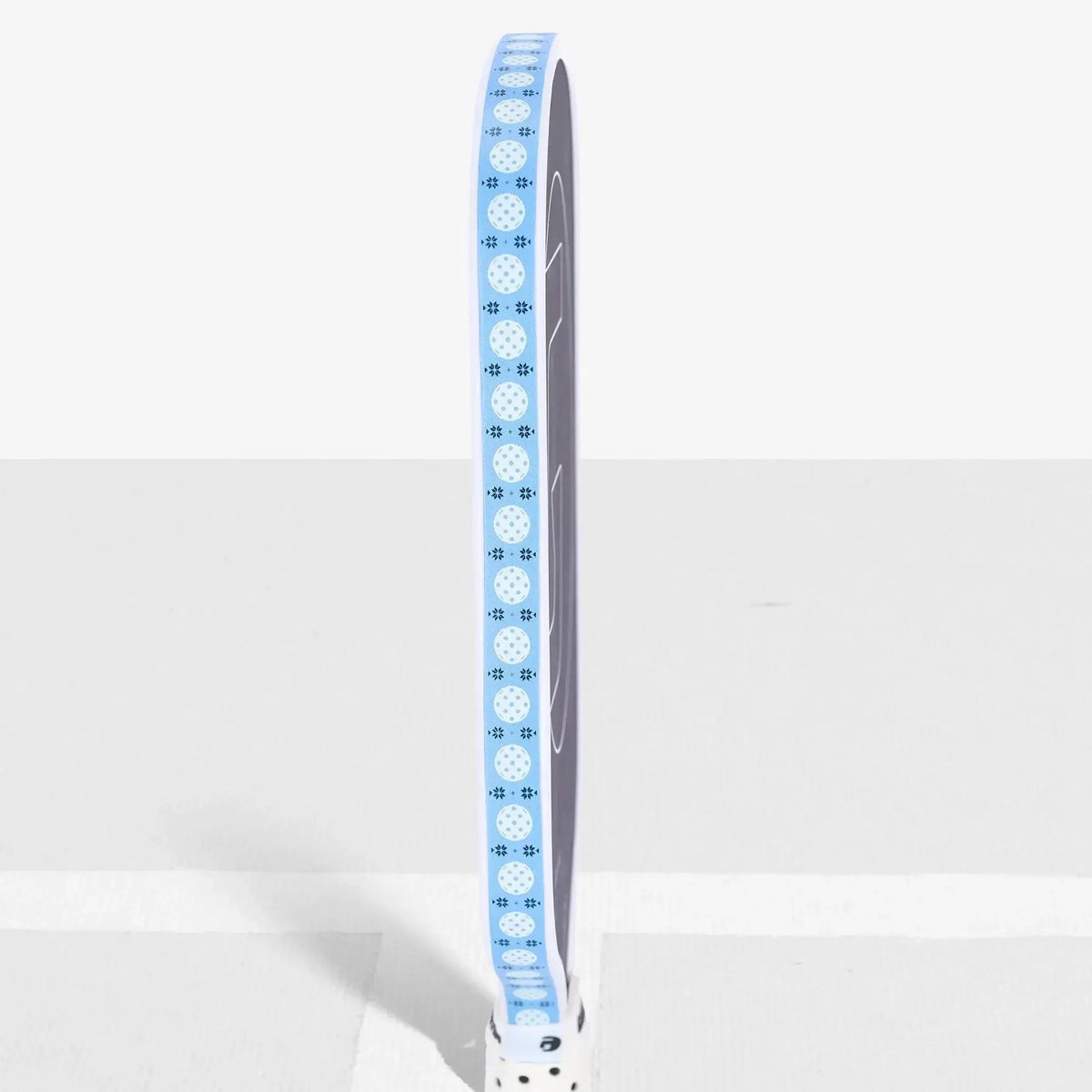 Pickleball paddle edge guard tape with a decorative pattern, designed to protect the paddle edge from wear and damage.