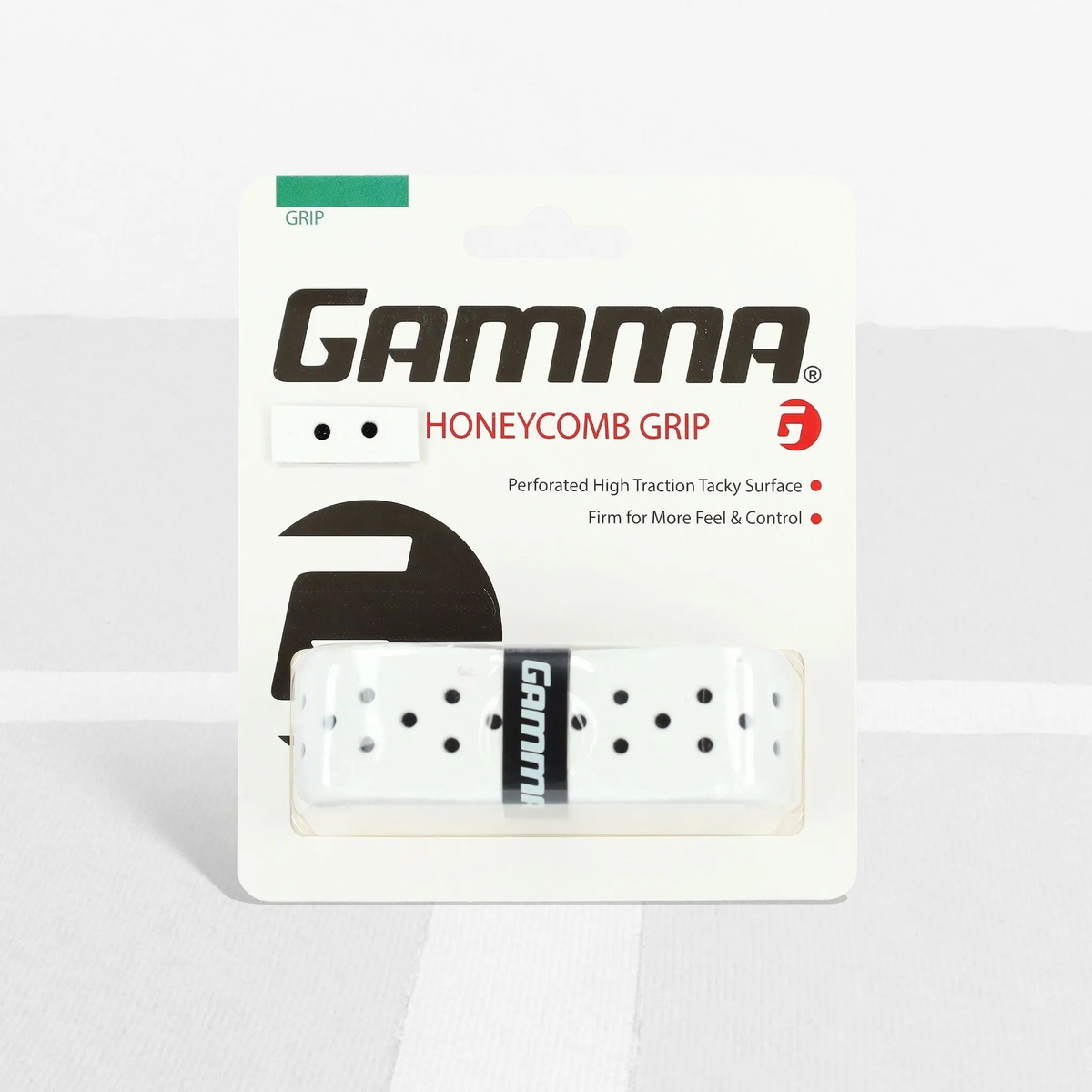 Packaged racquet grip with a perforated honeycomb texture, designed to provide high traction, enhanced feel, and improved control during play.