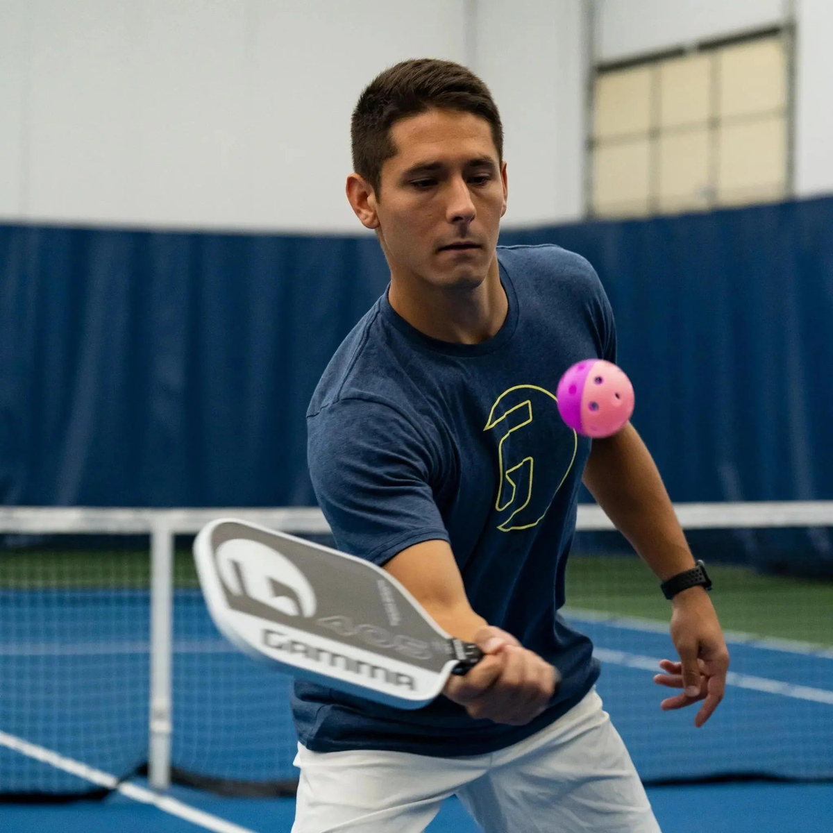 Indoor training pickleball with a two-piece design and evenly spaced holes, built for controlled play and consistent bounce during practice.