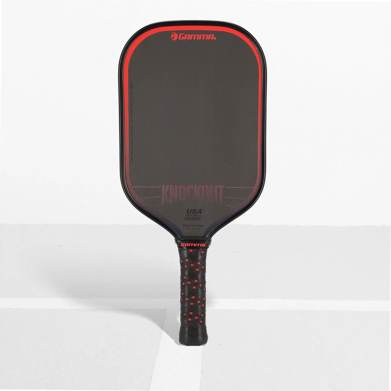 Pickleball paddle with a sleek solid face and cushioned handle, designed for power and control during gameplay.
