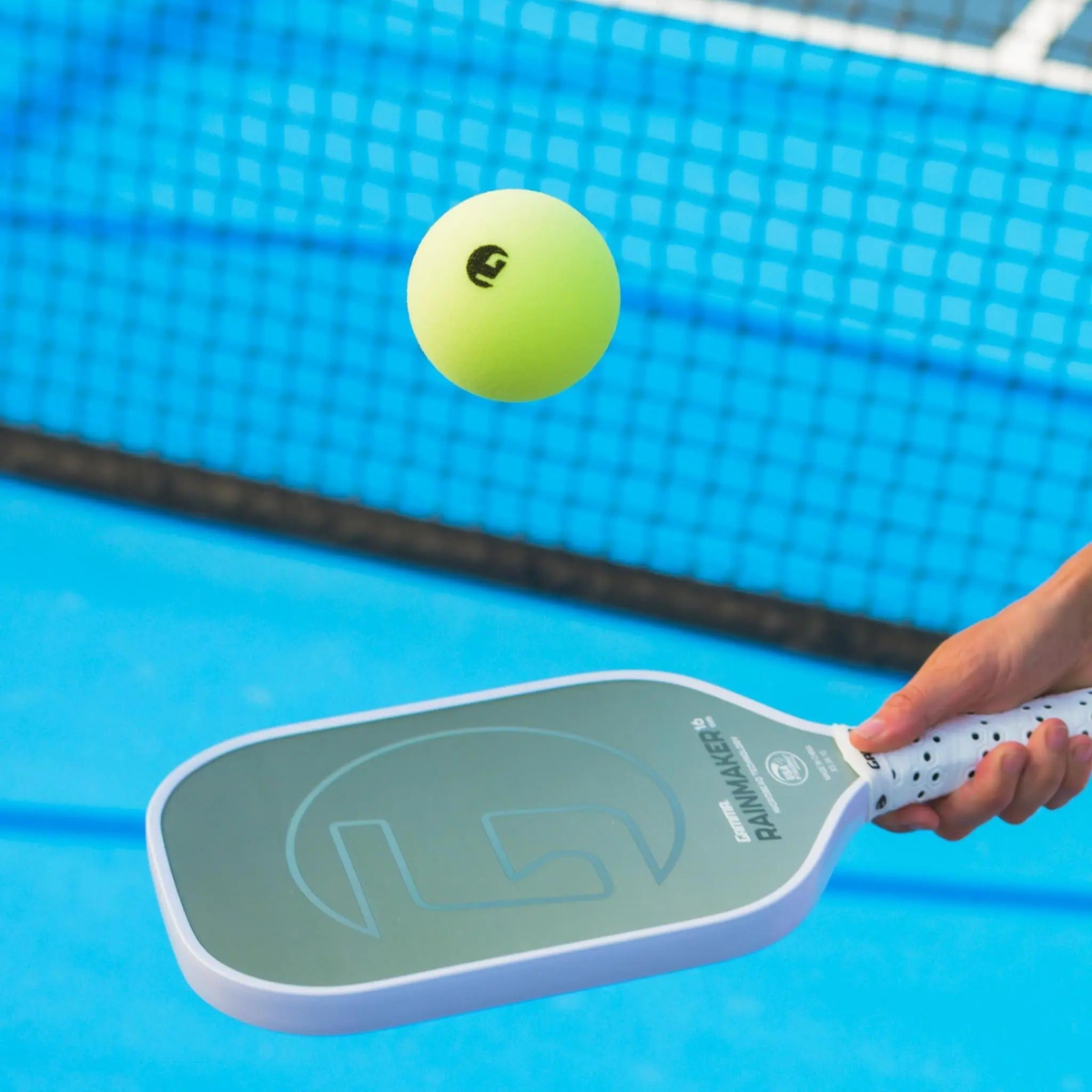 Foam pickleball designed for training or practice, featuring a smooth surface and lightweight construction.