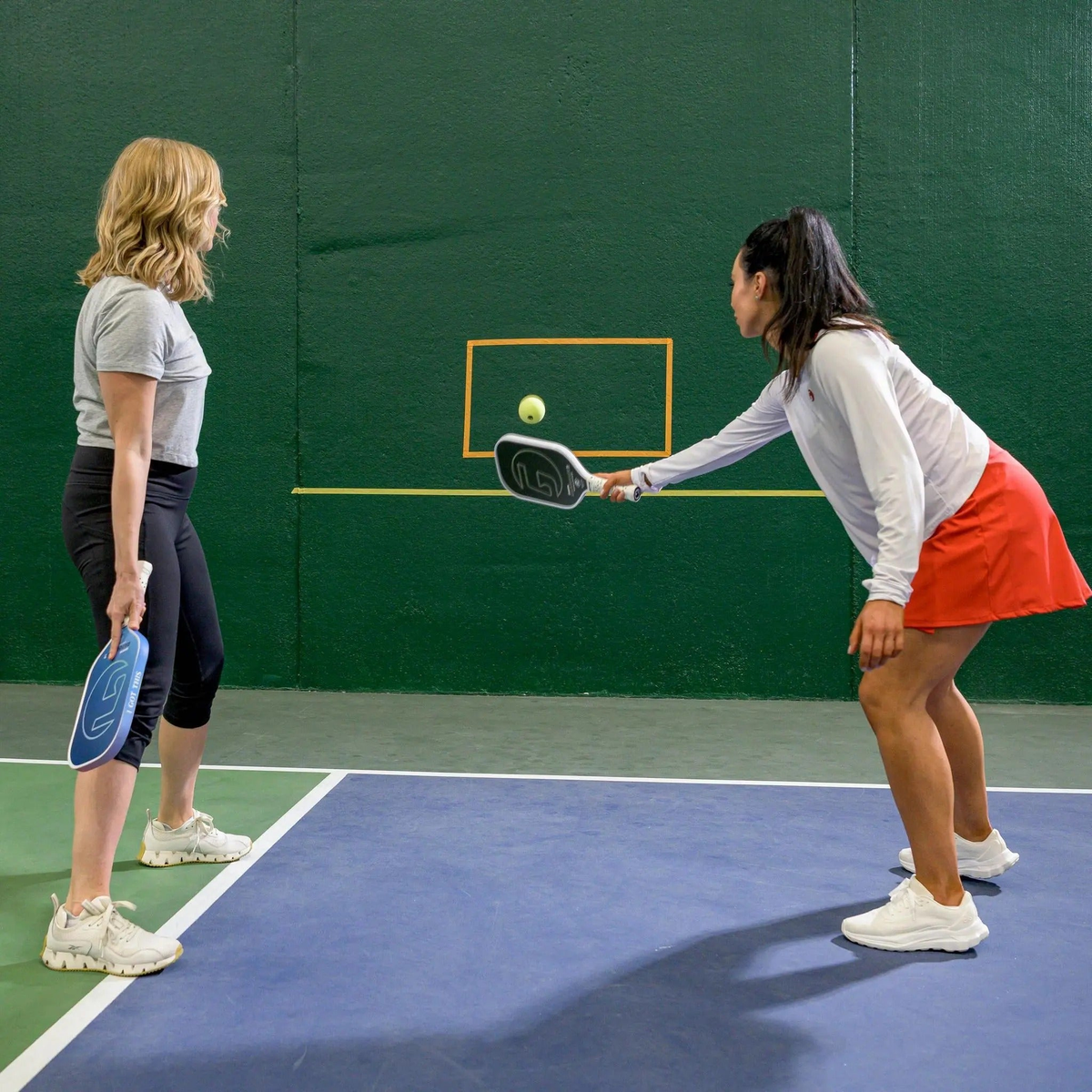 Foam pickleball designed for training or practice, featuring a smooth surface and lightweight construction.