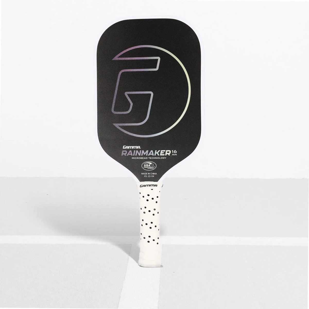 Pickleball paddle featuring a textured face and ergonomic handle, designed for control and performance during play.