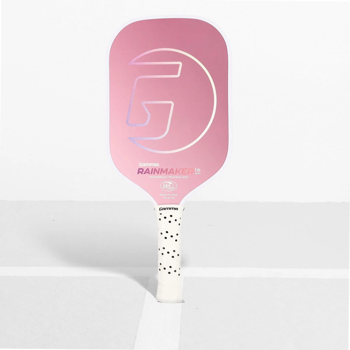 Pickleball paddle featuring a textured face and ergonomic handle, designed for control and performance during play.