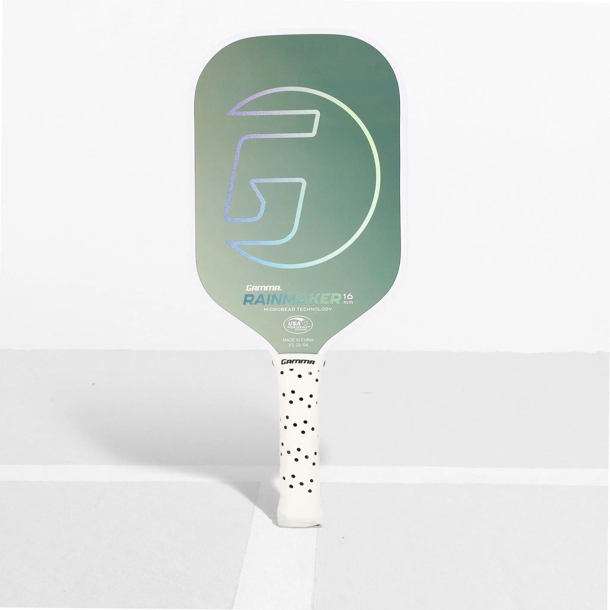 Pickleball paddle featuring a textured face and ergonomic handle, designed for control and performance during play.