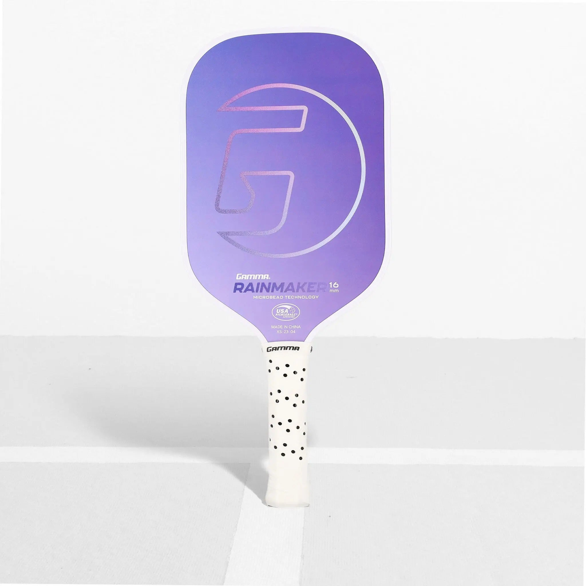 Pickleball paddle featuring a textured face and ergonomic handle, designed for control and performance during play.