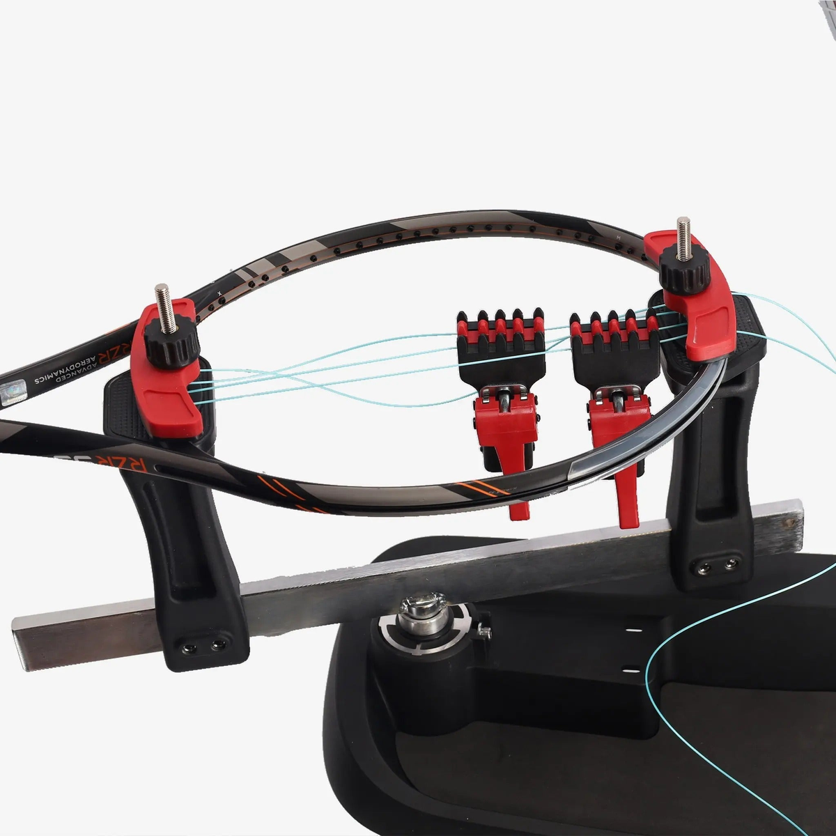 Manual drop weight stringing machine with a base platform, vertical support posts, adjustable tension arm, and mounting clamps for securing racquets during stringing.
