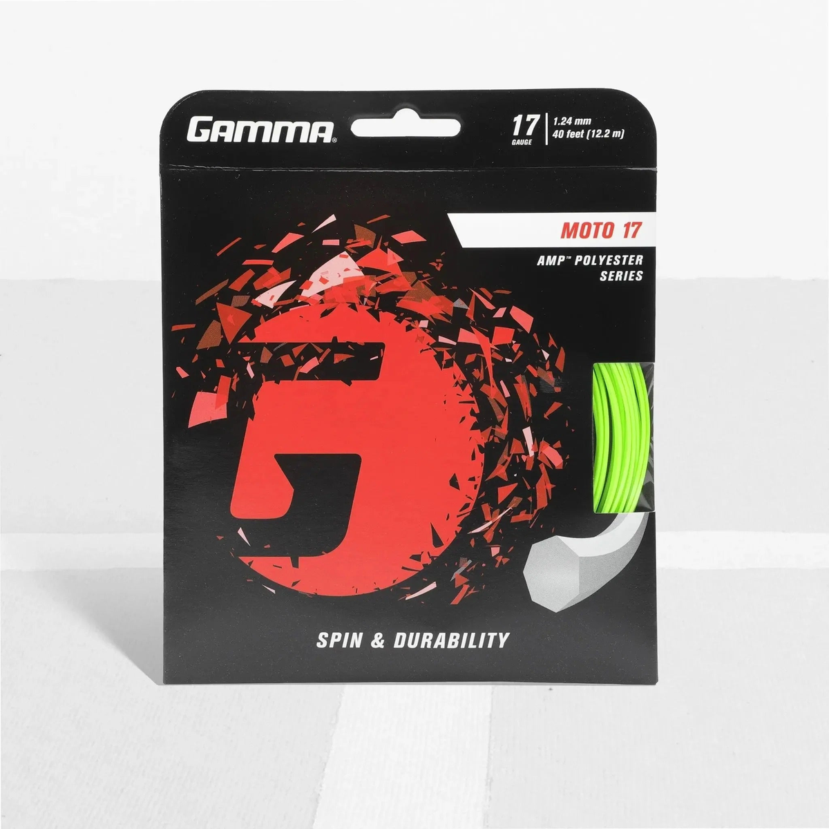 Packaged polyester tennis string set with branded card backing and visible coiled string segment, designed for spin and durability performance.