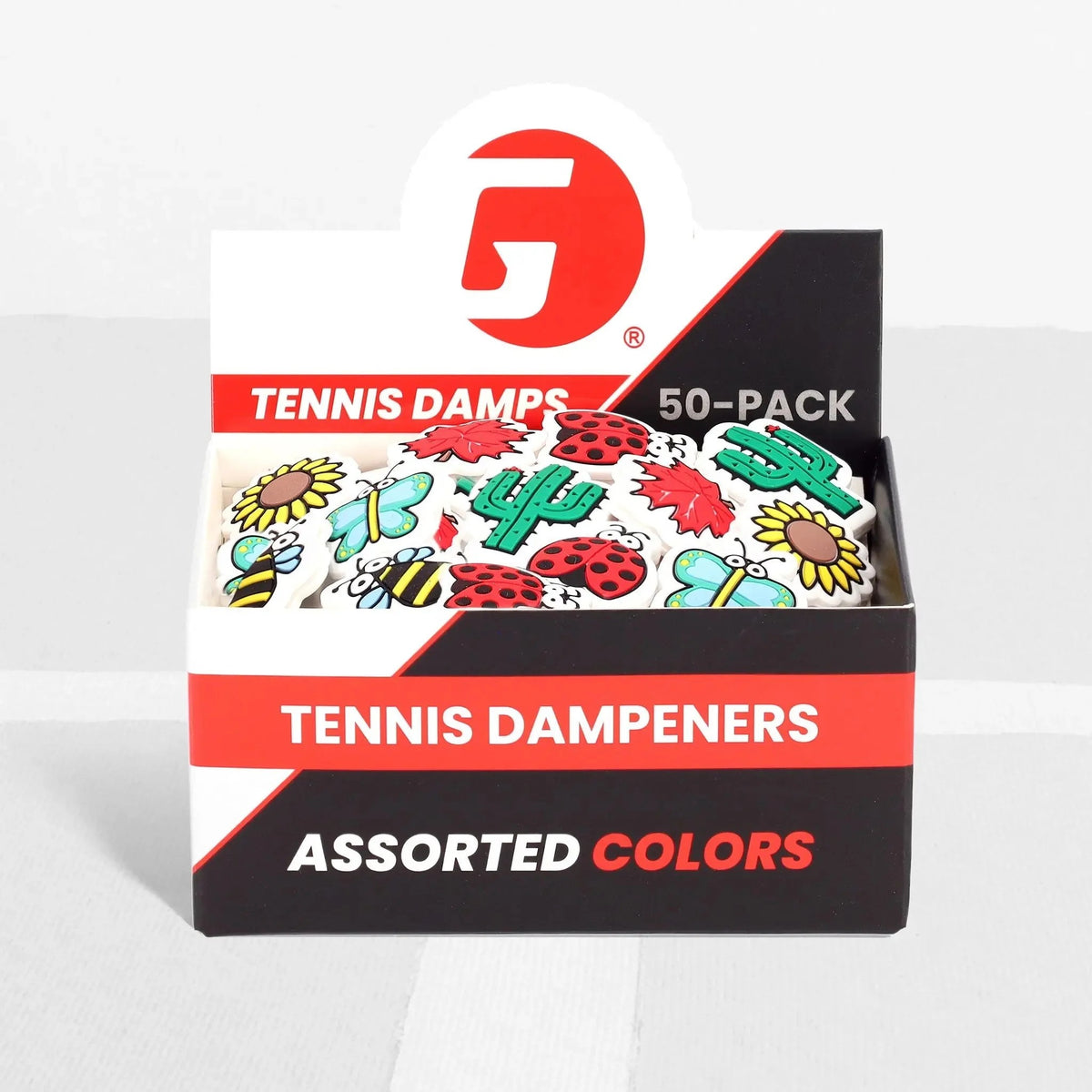 Box of assorted tennis dampeners featuring nature-themed shapes, designed to reduce vibration on racquet strings.