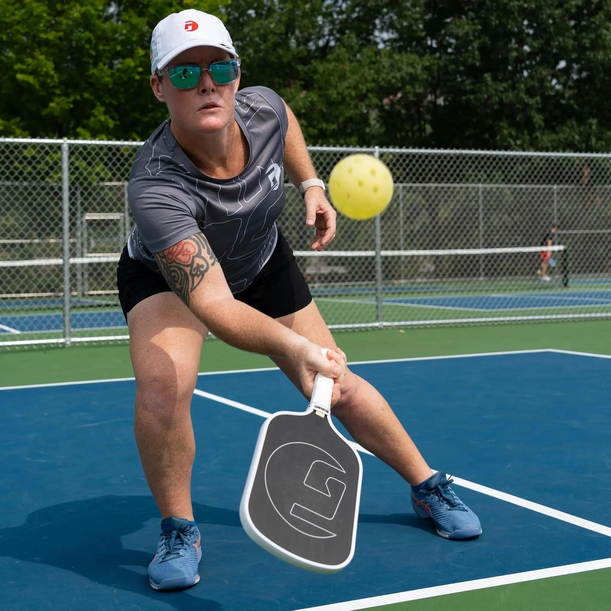 Outdoor pickleball with durable construction and precision-drilled holes, designed for consistent flight and performance in outdoor conditions.