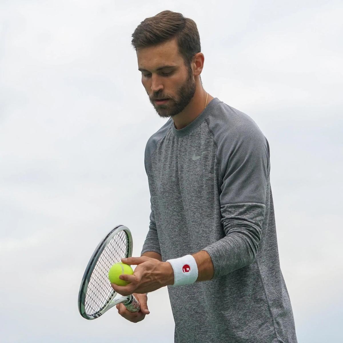 Assorted tennis balls piled together, designed for practice and long-lasting play with pressureless construction.