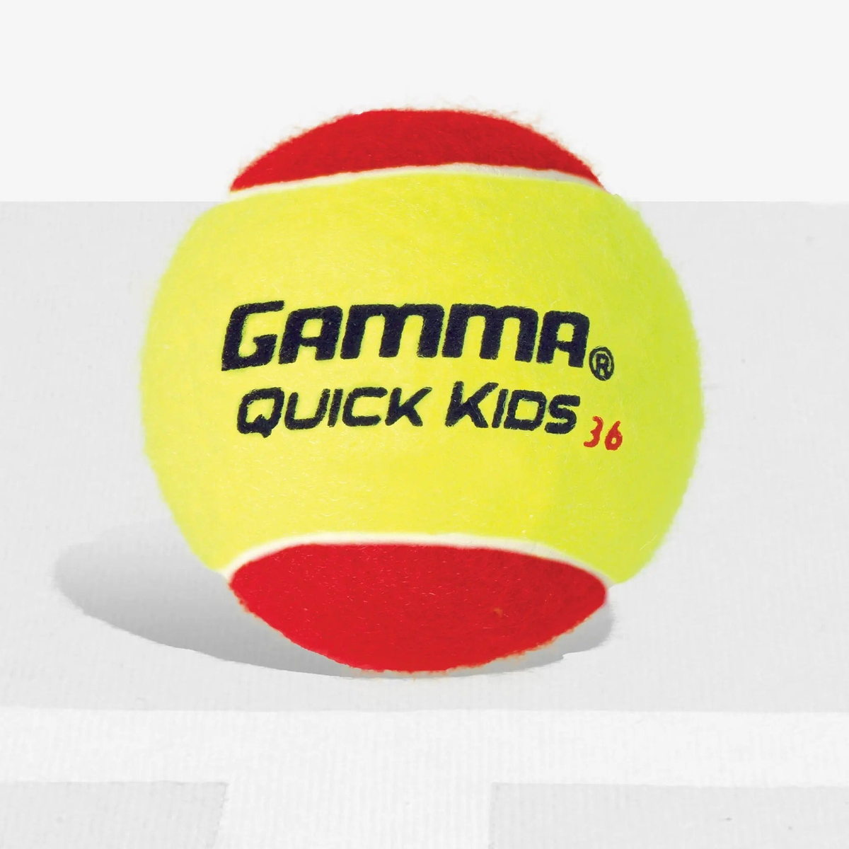 Youth training tennis ball designed for beginner players, featuring a softer construction for controlled bounce and easier skill development on smaller courts.
