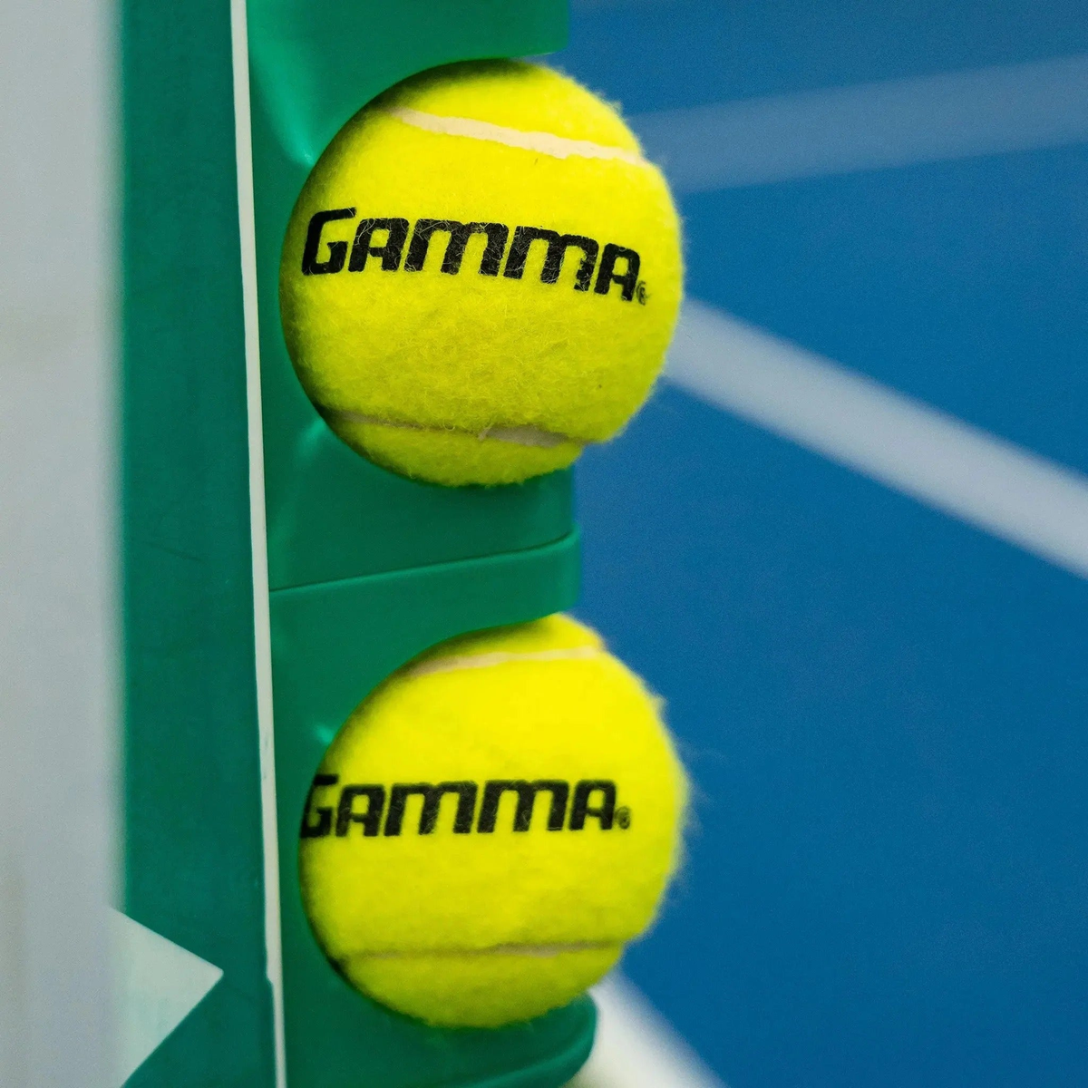 Portable scorekeeping post with rotating number panels and ball holders, designed for tracking game scores on court.