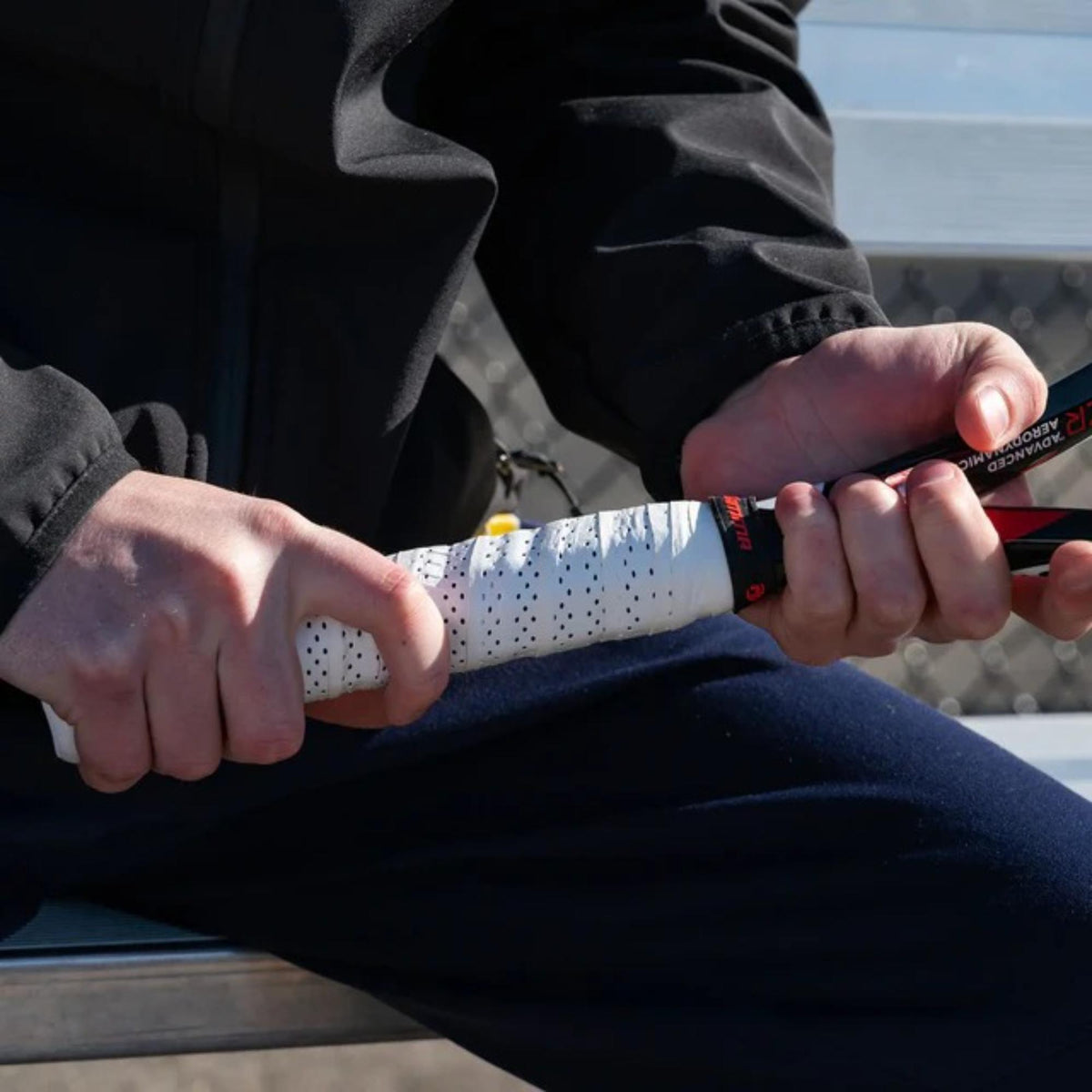 Tennis racket perforated overgrip pack with multiple grip wraps in retail packaging, designed for enhanced moisture absorption, traction, and durability.