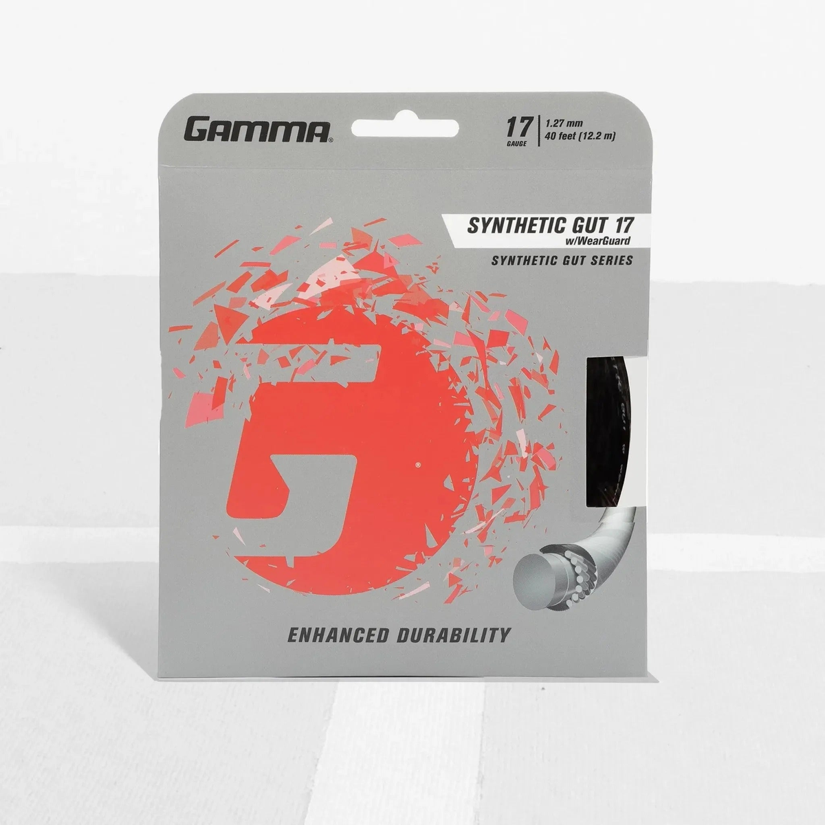 Tennis racket synthetic gut string set with wear-resistant construction in retail packaging, designed for enhanced durability and performance.