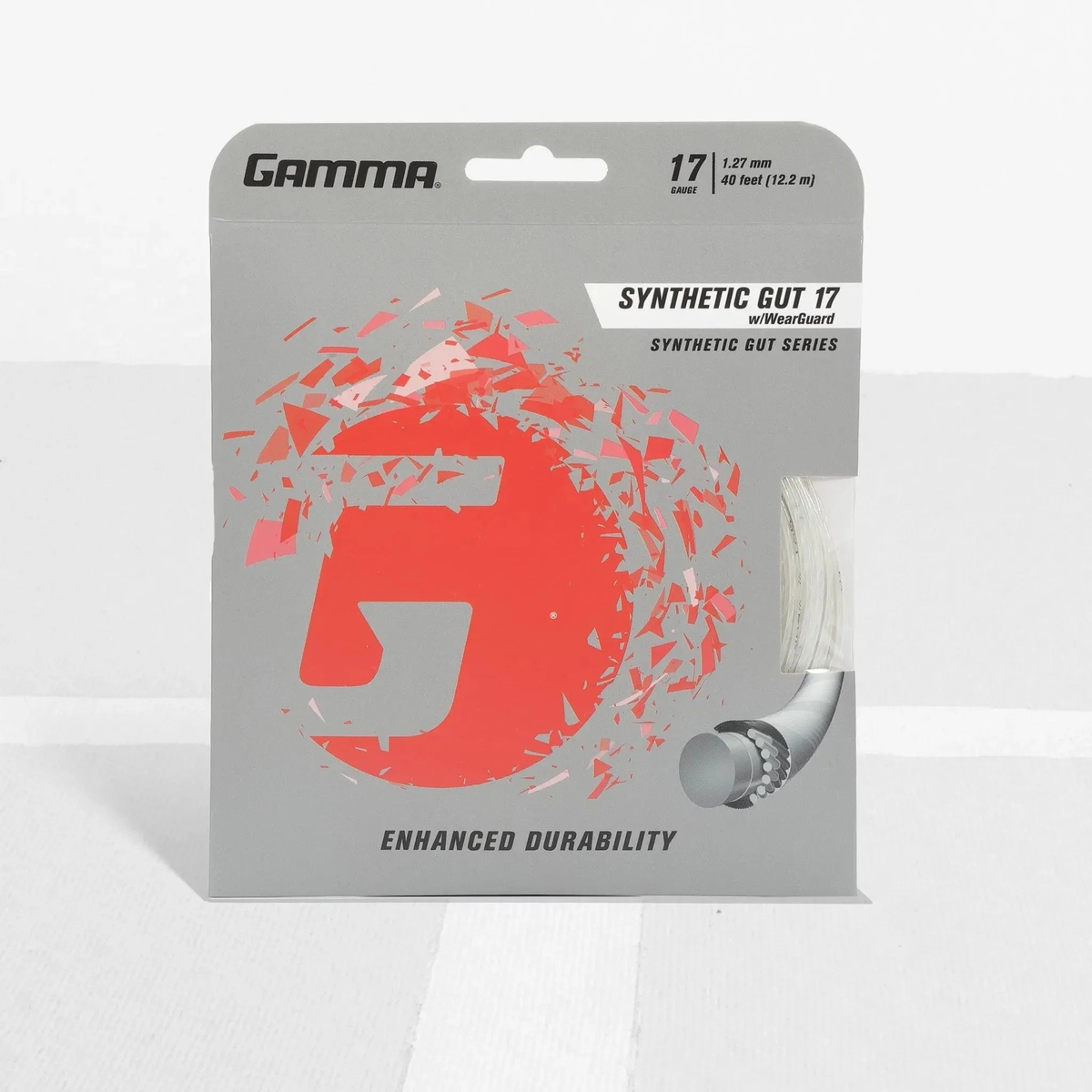 Tennis racket synthetic gut string set with wear-resistant construction in retail packaging, designed for enhanced durability and performance.