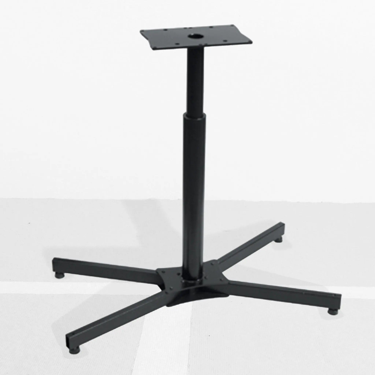 Tabletop stringing machine floor stand with a stable base and adjustable vertical support post, designed to securely hold a stringing machine at working height.