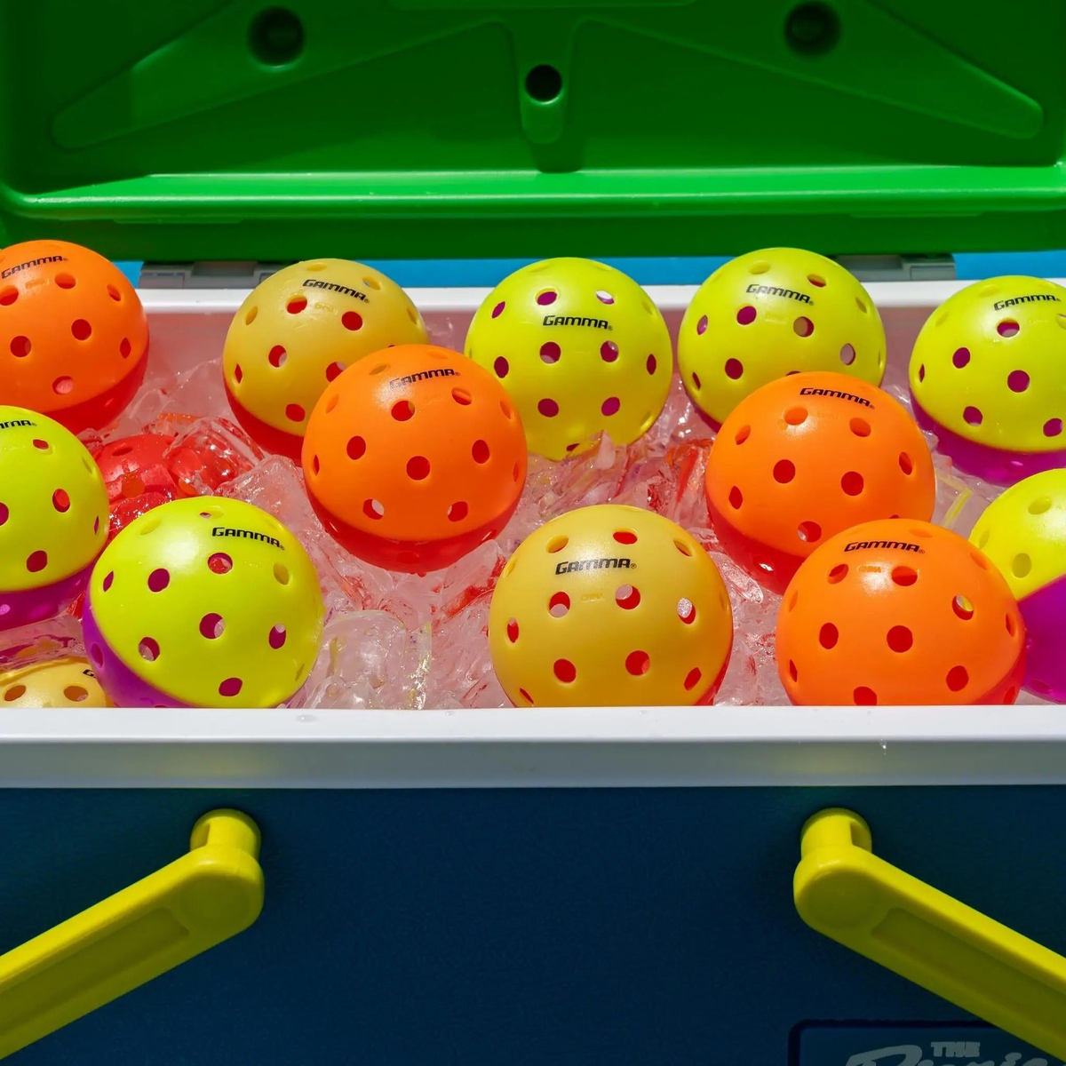Outdoor pickleball with a two-tone design and evenly spaced holes, designed for training and practice play.