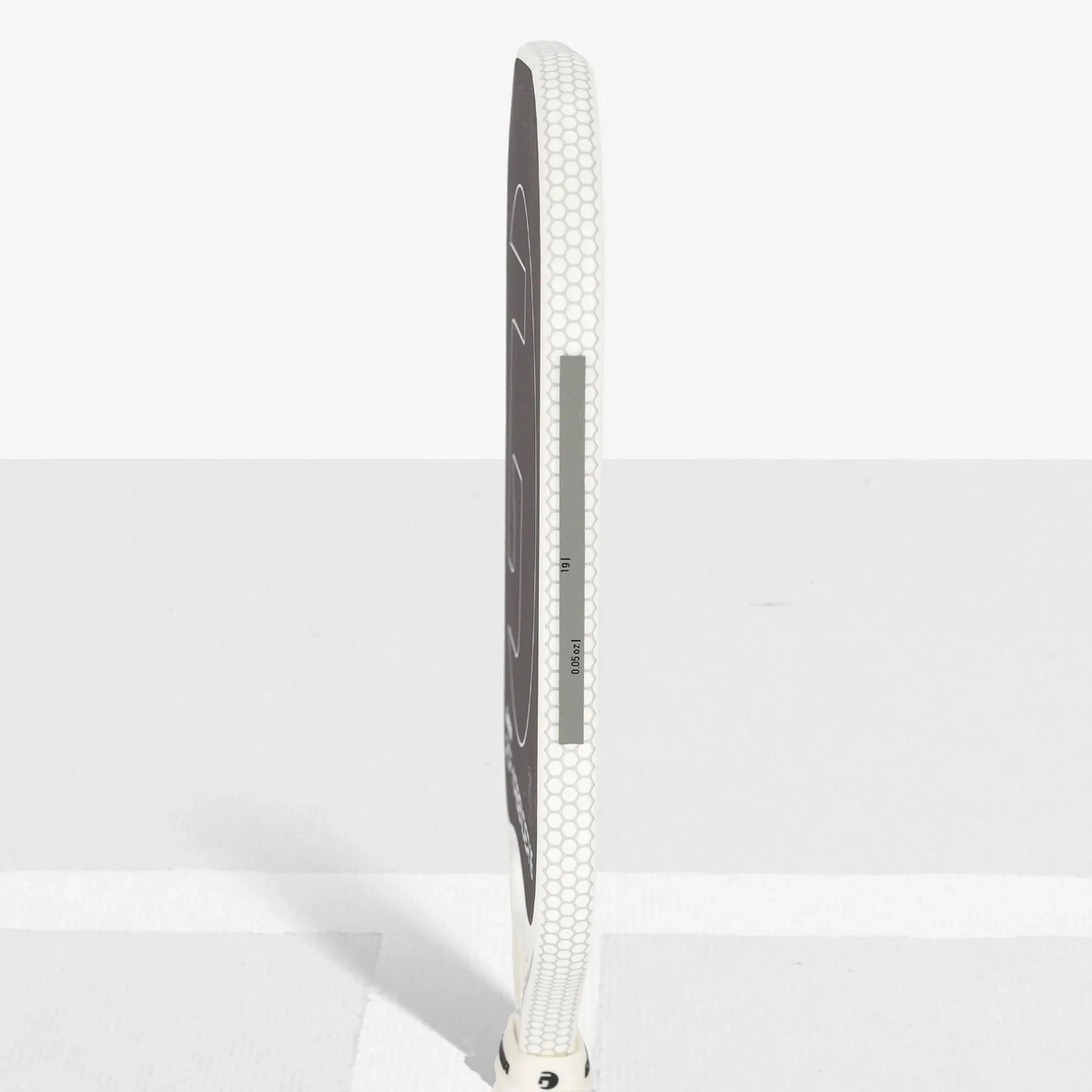 Roll of weighted tape for racquet customization, designed to add weight and adjust balance for improved performance.