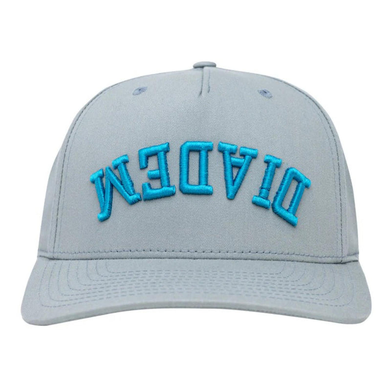 Structured baseball cap with curved brim and embroidered branding displayed upside down on the front panel.