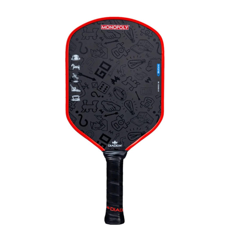 Diadem Edge BluCore x Monopoly limited edition pickleball paddle featuring a patterned face with Monopoly-themed icons and branding, shown upright with handle visible.