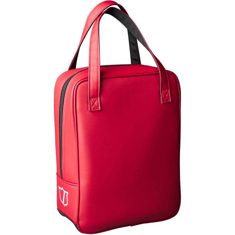 Wilson Golf practice bag in red and white with large Wilson logo, dual carry handles, and zippered closure, designed for storing golf balls and accessories.