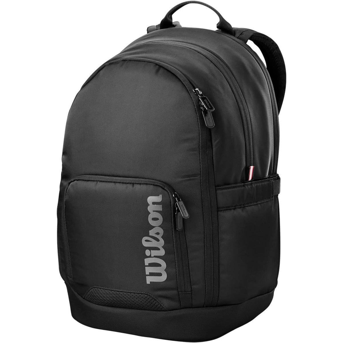 Wilson Golf Tour backpack in black with multiple zippered compartments, padded shoulder straps, and vertical Wilson logo, shown on a white background.