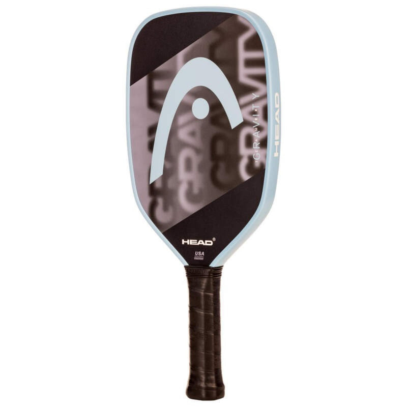 Head Gravity beach tennis paddle with glossy mauve and black face design, light blue frame, and black grip, shown front view on white background.