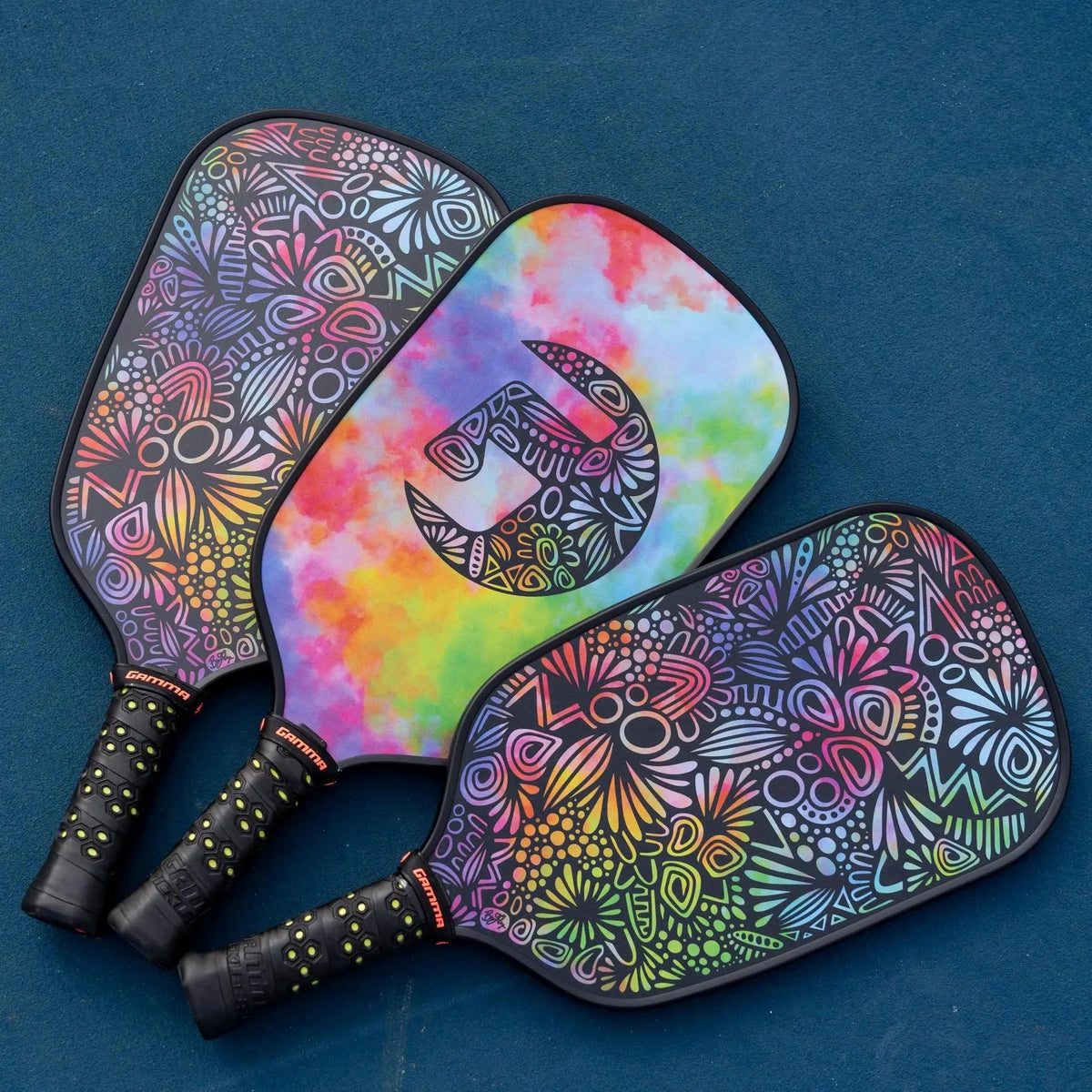 Pickleball paddle with a textured face, elongated shape, and cushioned grip handle designed for control and performance.