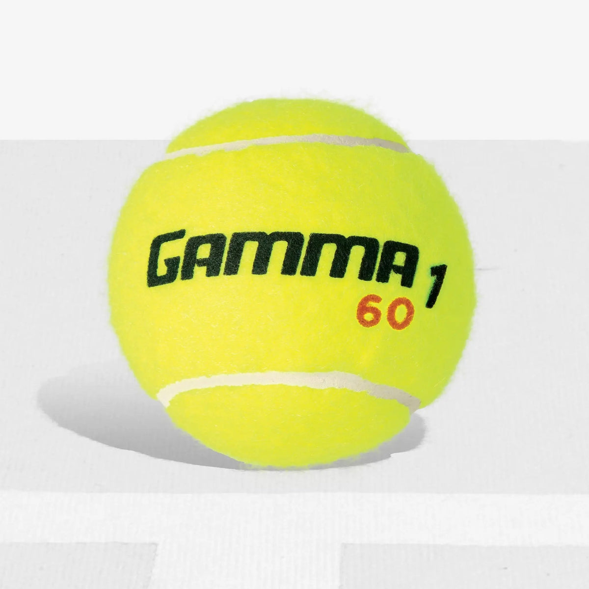 Low-compression tennis ball designed for beginner and training play, offering controlled bounce and slower speed.