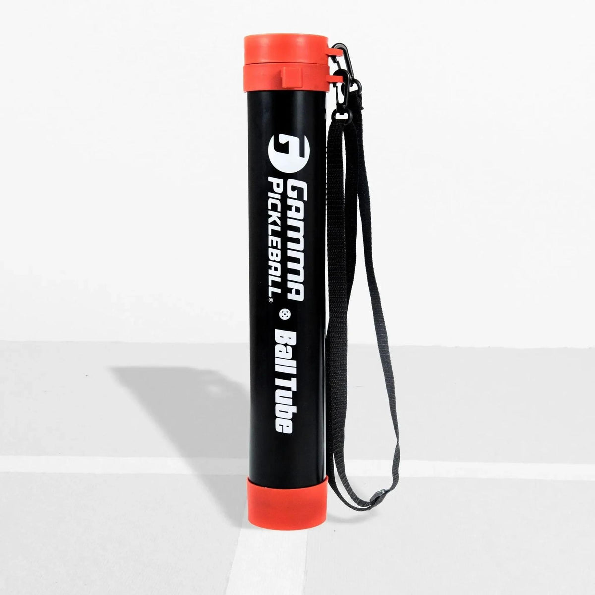 Portable pickleball ball tube with secure lid and shoulder strap, designed for easy storage and transport of pickleballs.
