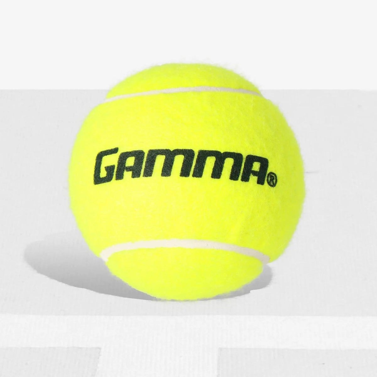 Assorted tennis balls piled together, designed for practice and long-lasting play with pressureless construction.