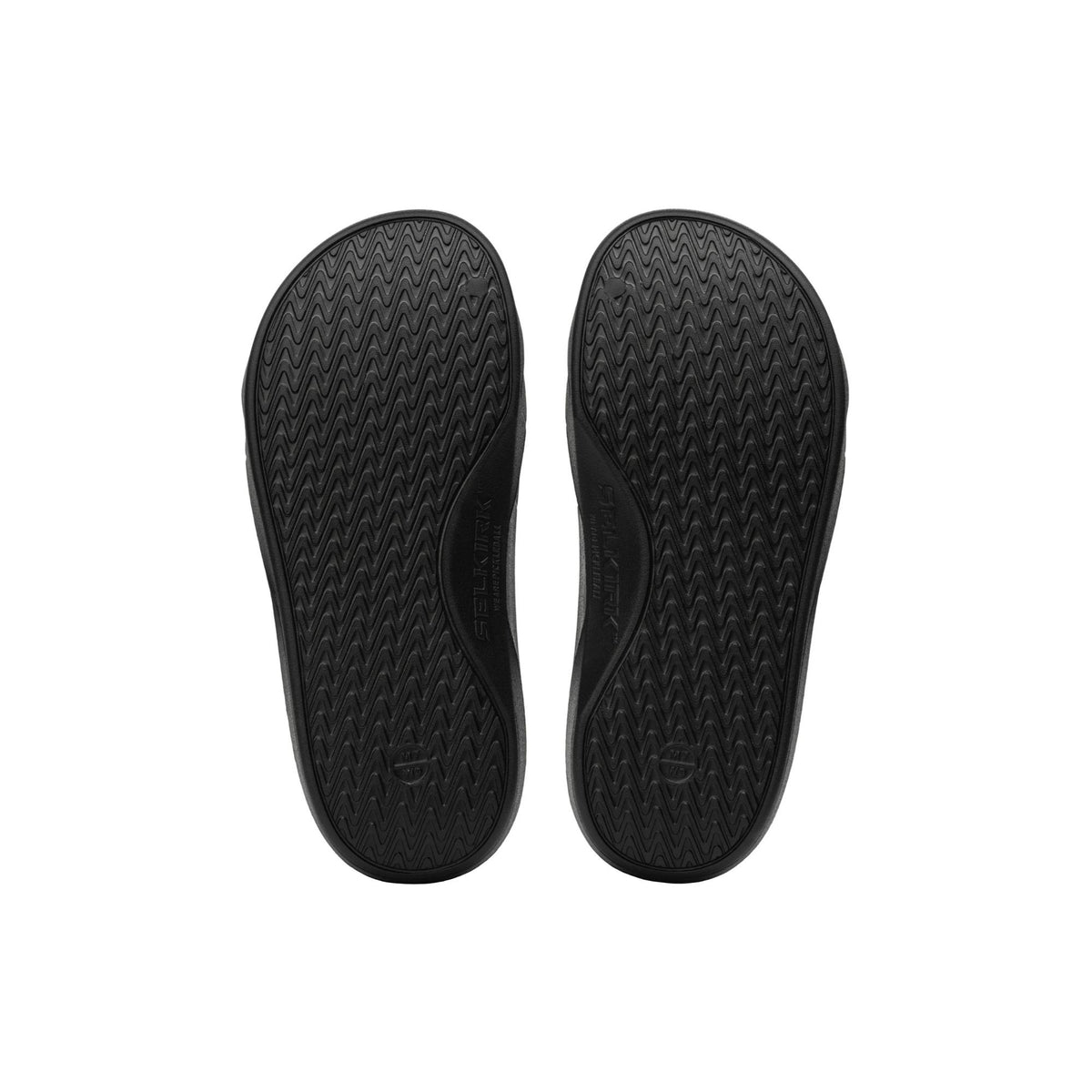 Selkirk Sport Podium pickleball slide sandals with a cushioned footbed, open-toe design, and wide strap featuring embossed branding, shown as a pair.