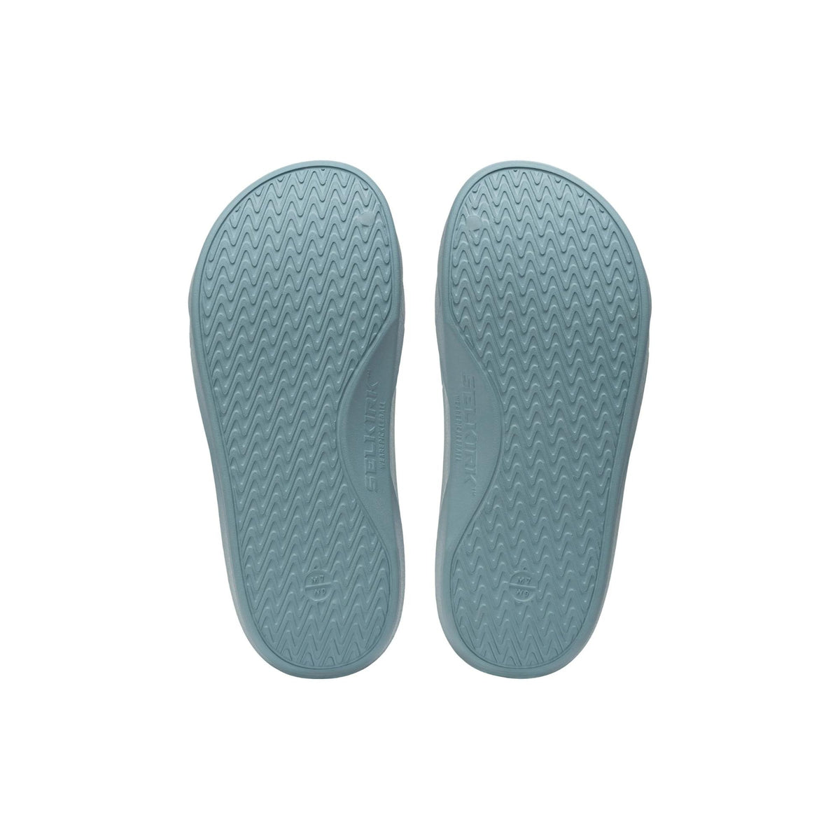 Selkirk Sport Podium pickleball slide sandals with a cushioned footbed, open-toe design, and wide strap featuring embossed branding, shown as a pair.