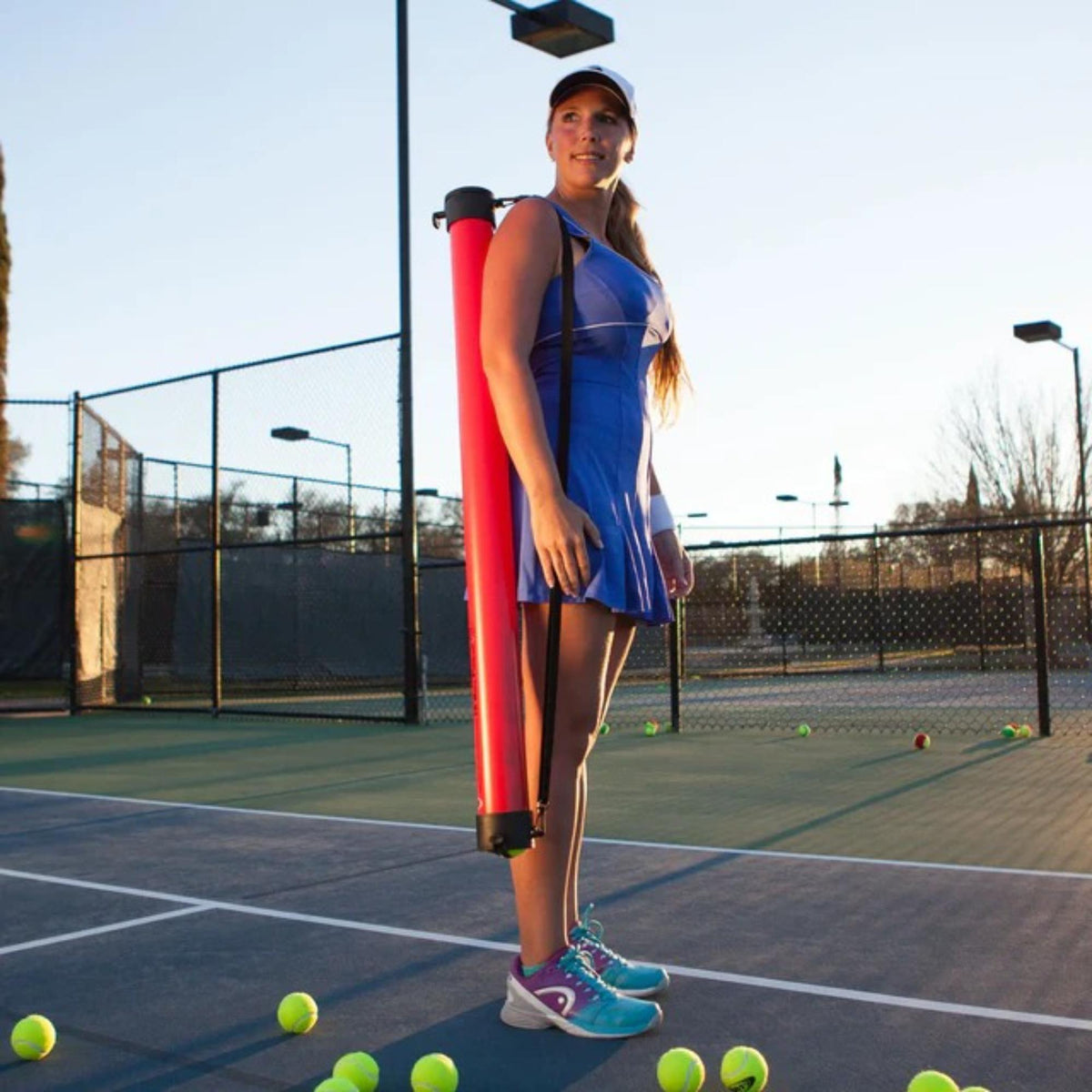 Ball tube pickup and storage tool designed to collect and hold multiple balls for easy transport and convenient practice use.