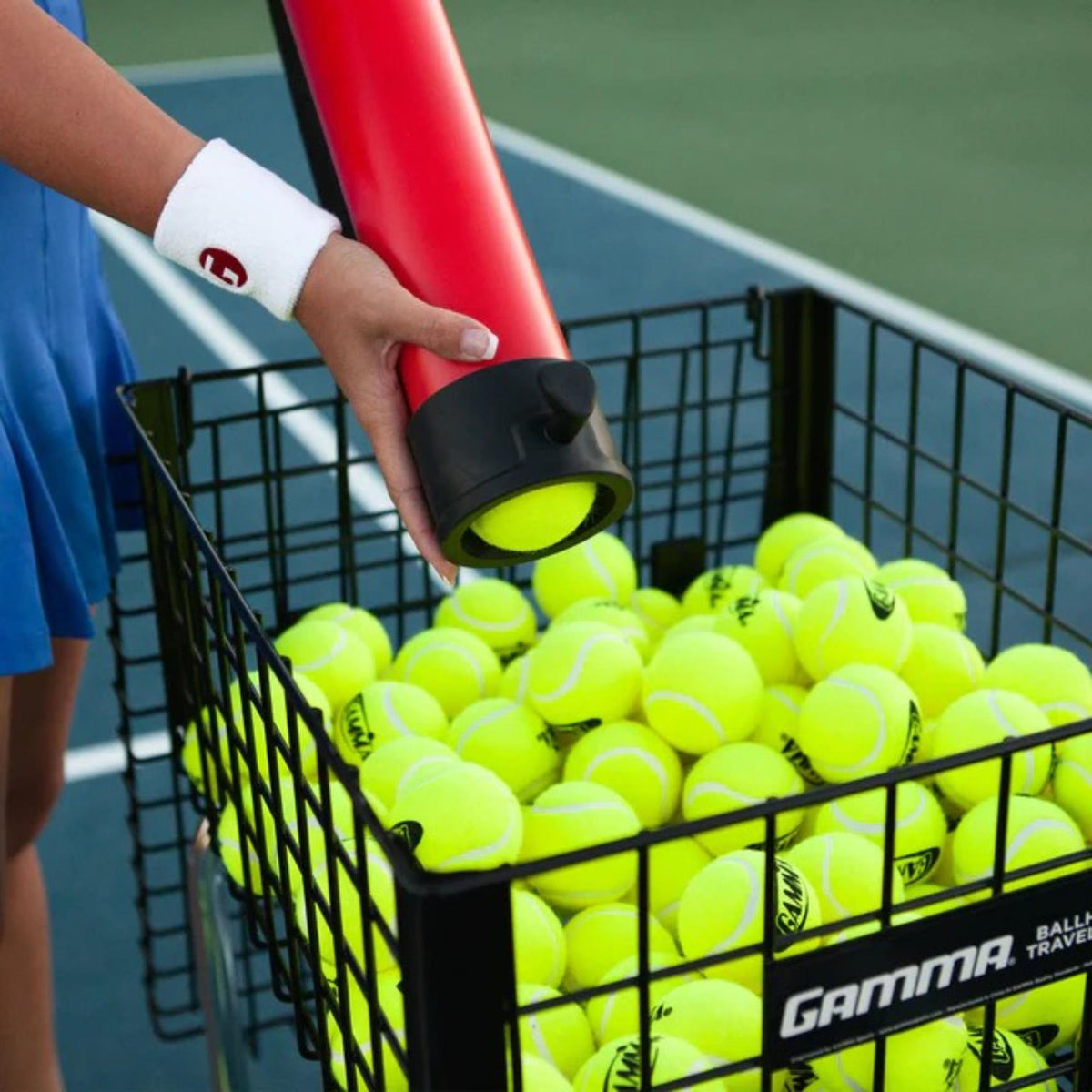 Ball tube pickup and storage tool designed to collect and hold multiple balls for easy transport and convenient practice use.