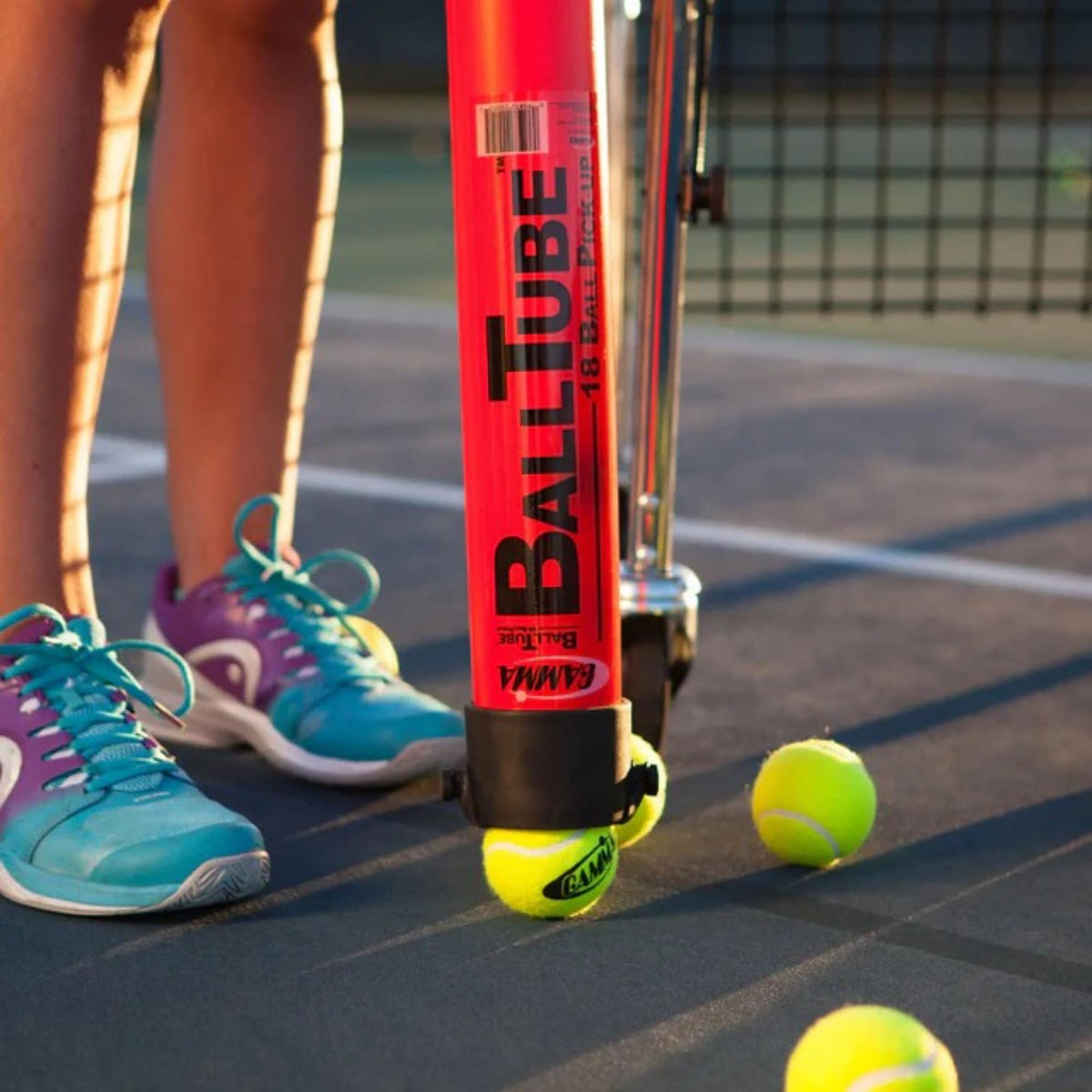 Ball tube pickup and storage tool designed to collect and hold multiple balls for easy transport and convenient practice use.