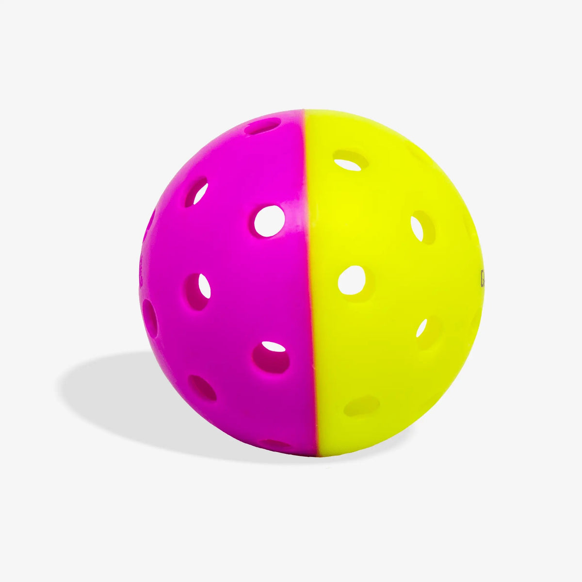 Outdoor pickleball with a two-tone design and evenly spaced holes, designed for training and practice play.